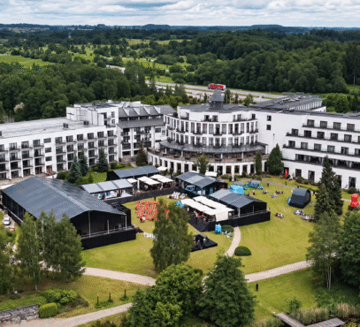 Aerial hotel grounds with event tents-1