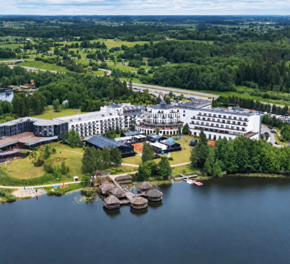 Aerial lakeside resort with event tents